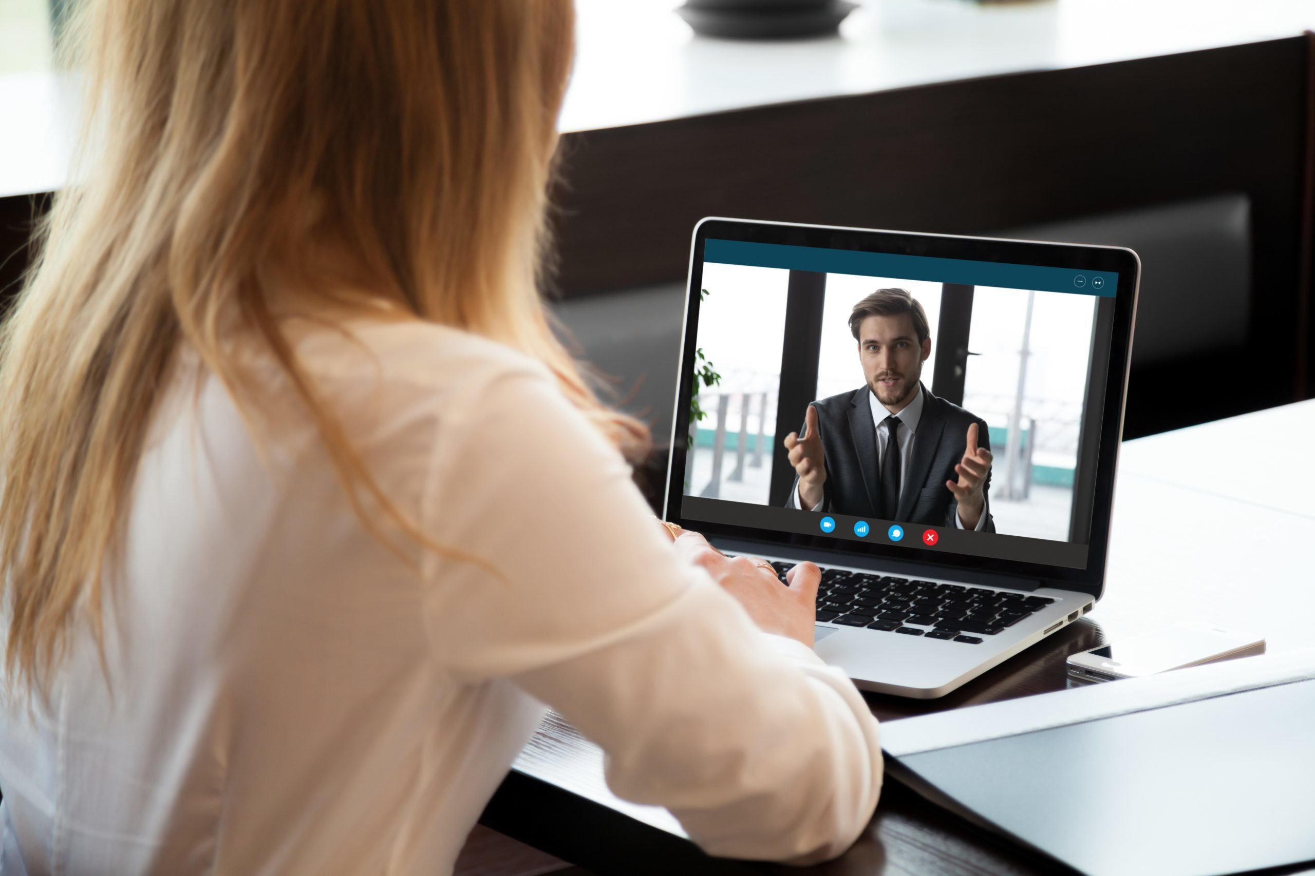 Female employee interviewing on video call with the hiring manager.